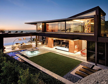 High-end modern architectural house with pool and open living concept.