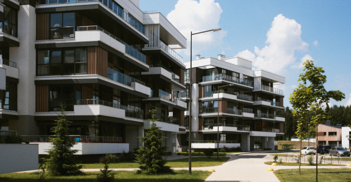 Modern apartment complex with balconies and green landscaping