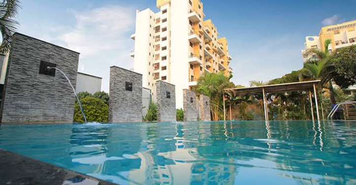 Residential apartment complex with a swimming pool in the foreground