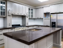 Modern kitchen interior with a large island and stainless steel appliances